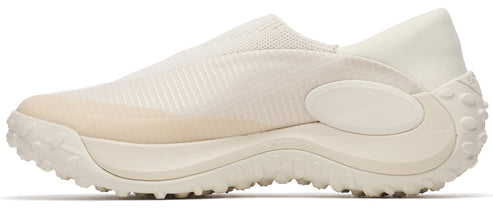 An off-white sneaker with a sock-like upper and a chunky sole.