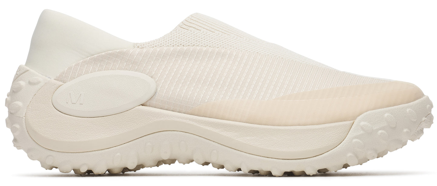 An off-white, slip-on sneaker with a textured sole.