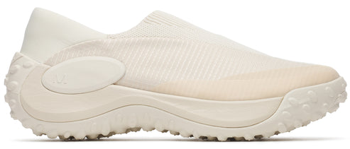 An off-white, slip-on sneaker with a textured sole.
