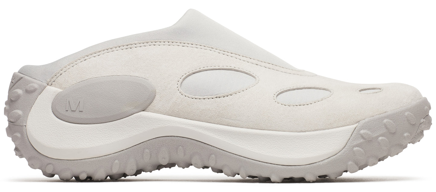 Off-white slip-on shoe with round cutouts and lugged sole.