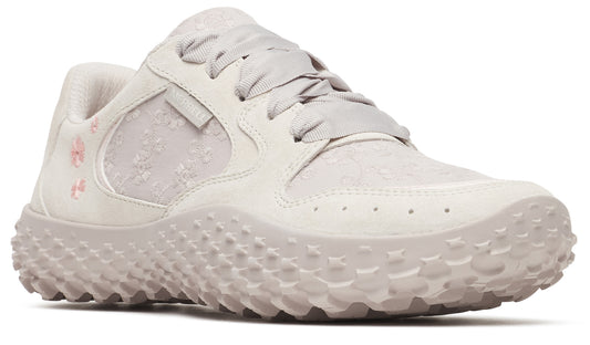 Off-white shoe with floral embroidery and textured sole.