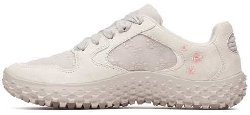 A floral designed sneaker with light pink flower details.