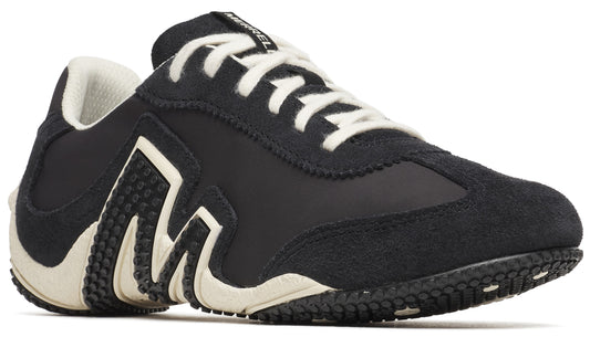 Black sneaker with white sole and laces, suede panels and zig-zag design.