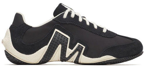 A black and white athletic shoe with white laces.