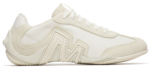 An off-white sneaker with white laces.