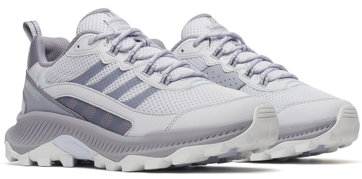 Two light grey athletic shoes with white laces, and grey soles.