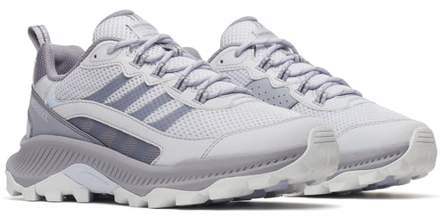 Two light grey athletic shoes with white laces, and grey soles.