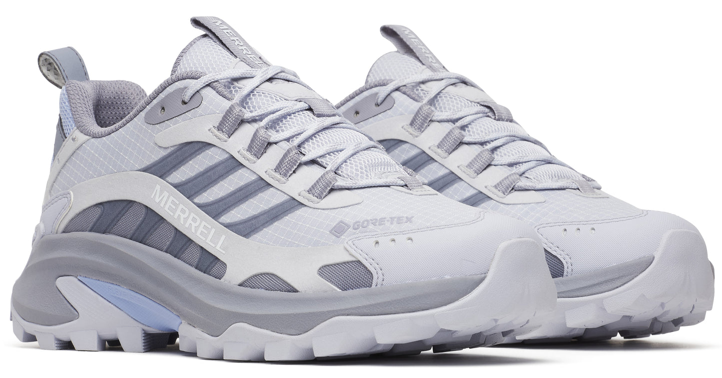 Pair of gray and white low-rise GORE-TEX hiking shoes with lug soles and the text "MERRELL" visible on the side of one shoe.