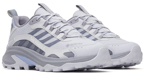 Pair of gray and white low-rise GORE-TEX hiking shoes with lug soles and the text "MERRELL" visible on the side of one shoe.