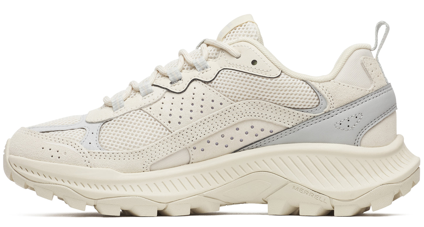 Beige low-top athletic shoe with a thick, lugged sole and lace-up closure.