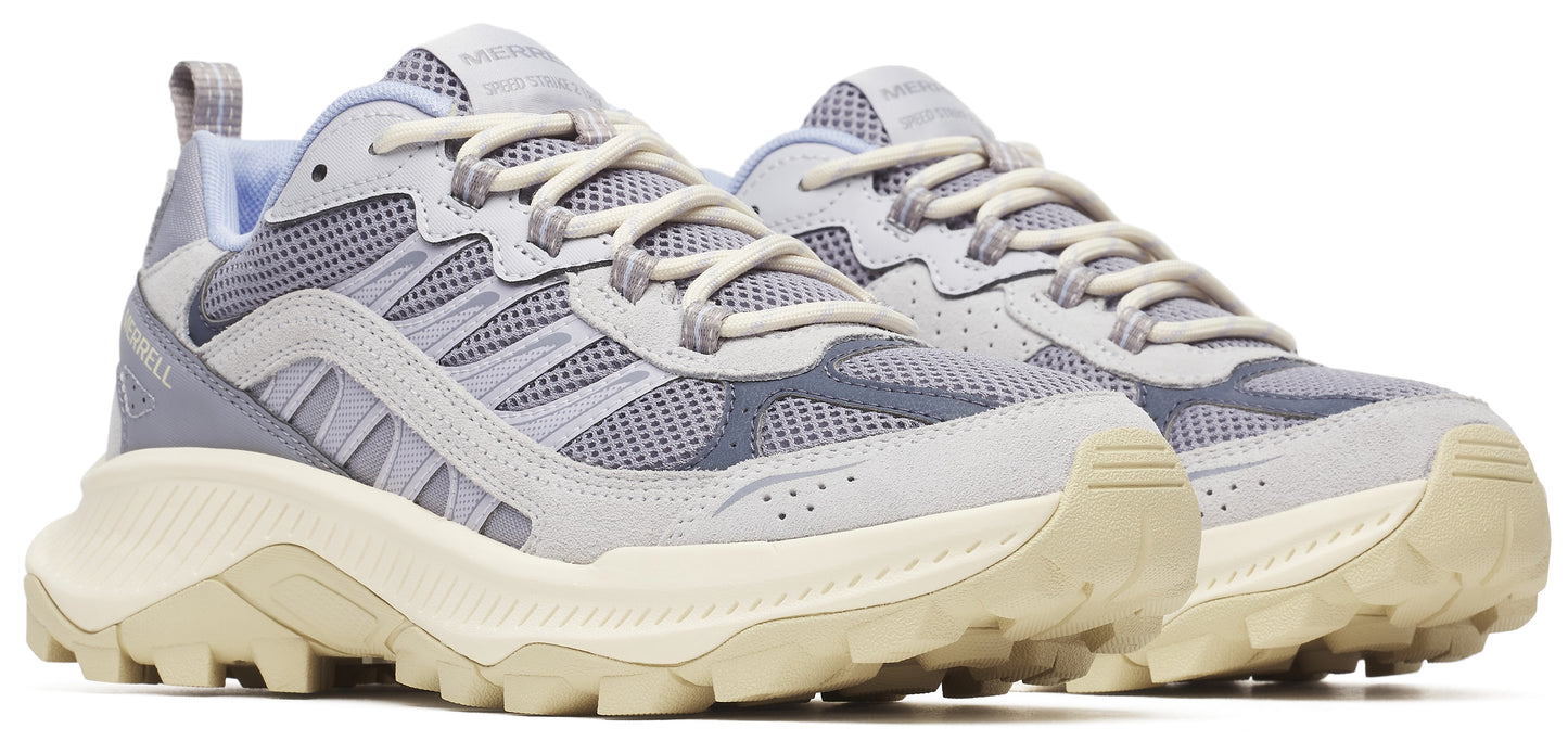 Pair of low-top sneakers with a chunky off-white sole and light grey mesh and suede uppers.