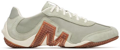 A low-top sneaker featuring an 'M' design on its side.