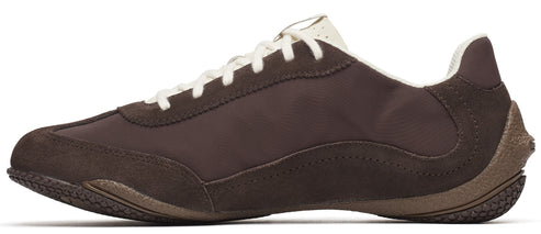 A brown athletic shoe with white laces.