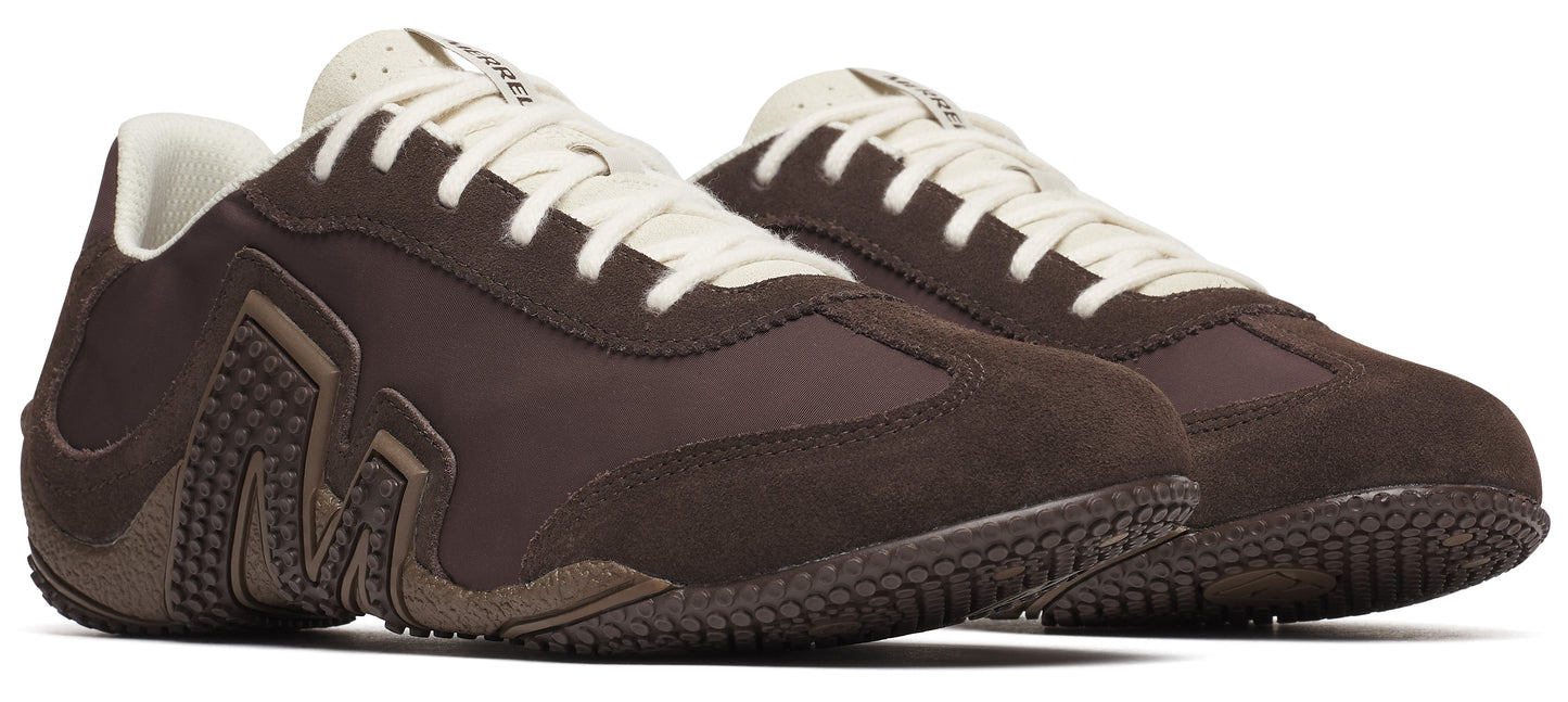 A pair of brown low-top sneakers with white laces.