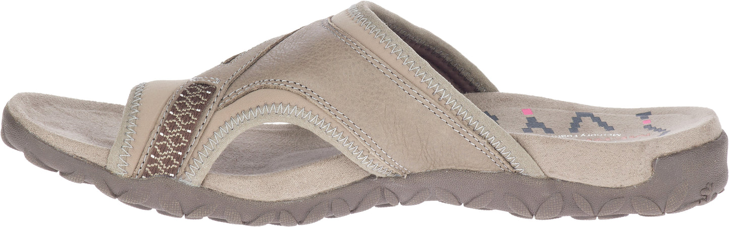 A beige slip-on sandal with a low heel and patterned upper strap.