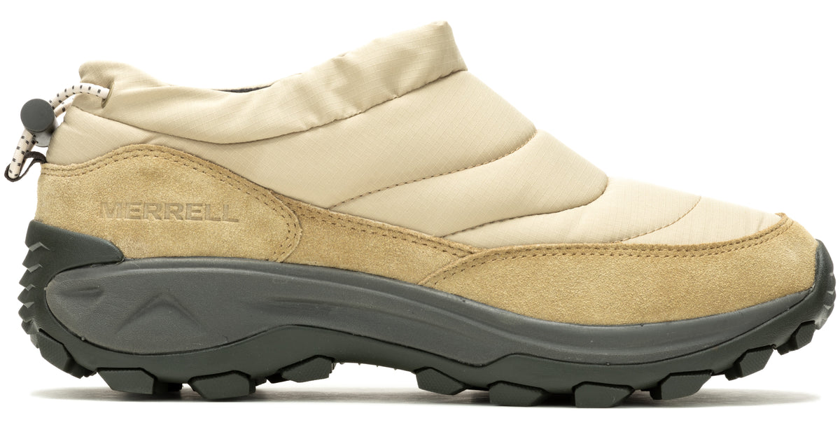 Beige and tan slip-on shoe with synthetic upper, suede rand, and a toggle-adjustable collar. The sole is chunky and dark gray with a lugged outsole. The brand name "MERRELL" is printed in small letters along the side.