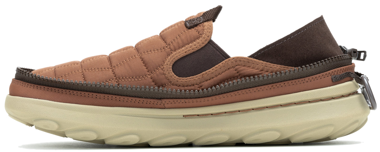 Slip-on shoe with a quilted brown upper and brown elastic inserts, features a brown band around the shoe and a tan sole.