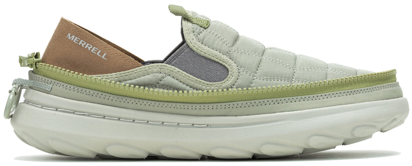 A sage green quilted slip-on shoe with a gray elastic band at the opening and a tan heel counter with the word MERRELL on it.