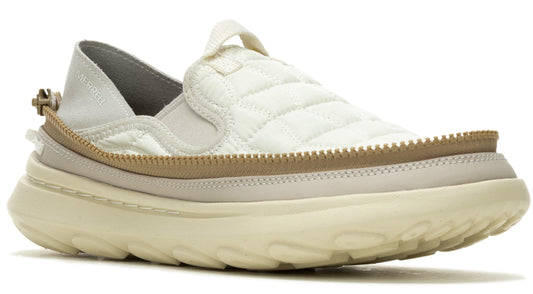 Slip-on shoe with a quilted upper, tan trim, elastic bands on the side, and a thick, textured sole.