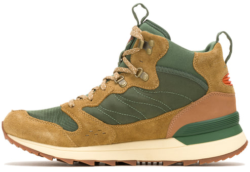 Hiking boot in brown, green and tan with a cream colored sole.