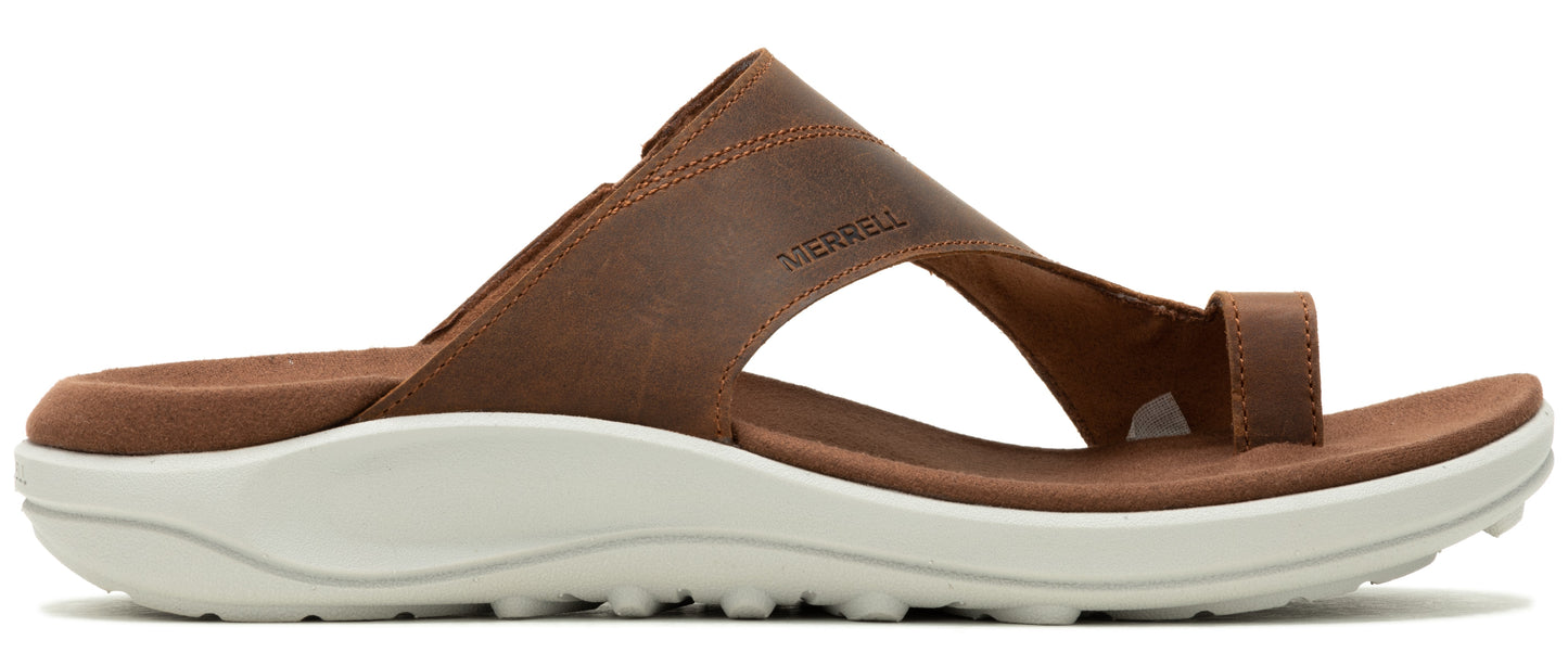 A brown sandal with a white sole.