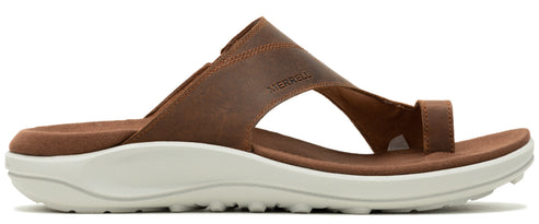 A brown sandal with a white sole.
