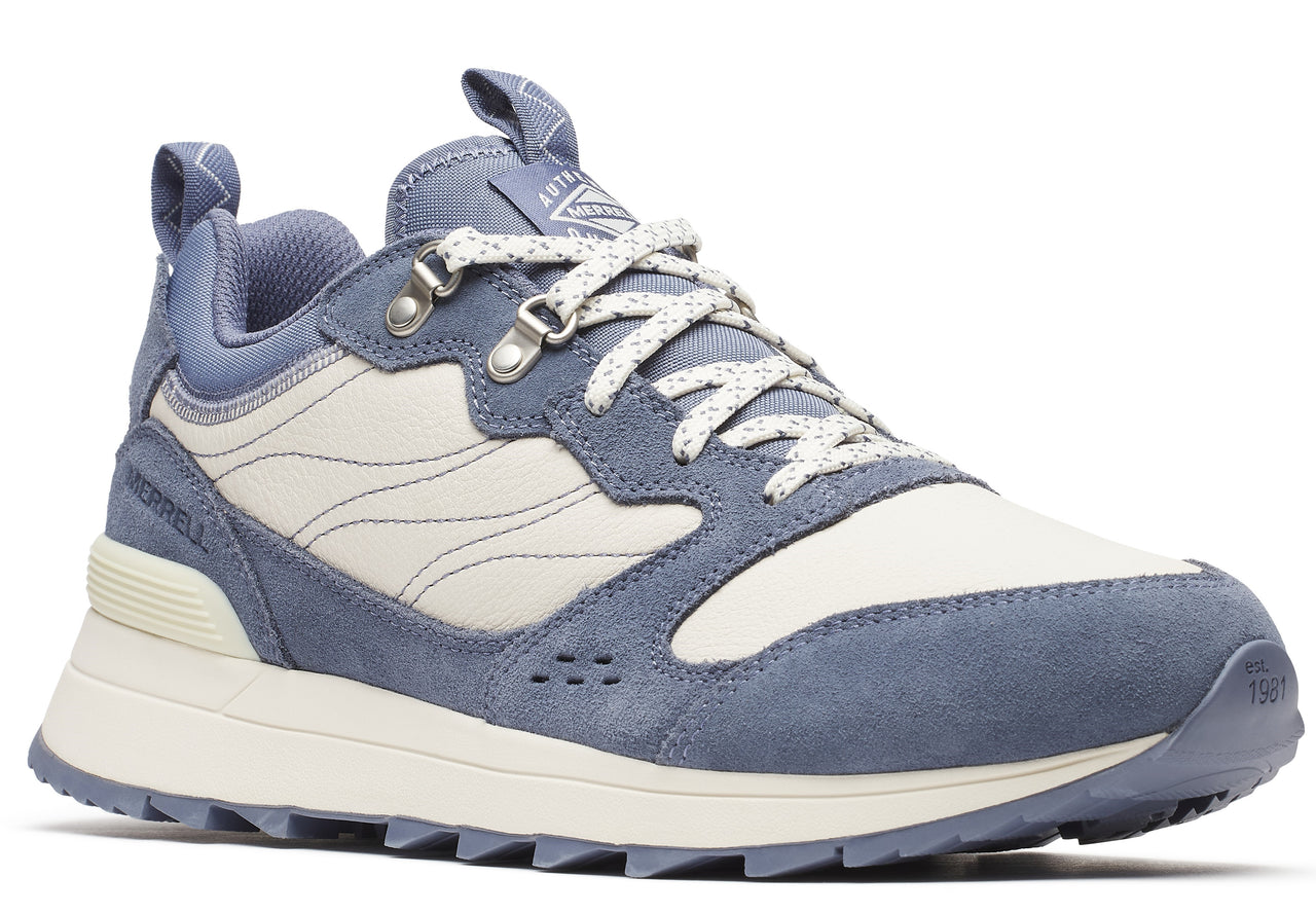 A light blue and white low-top hiking shoe with a lug sole and patterned laces.