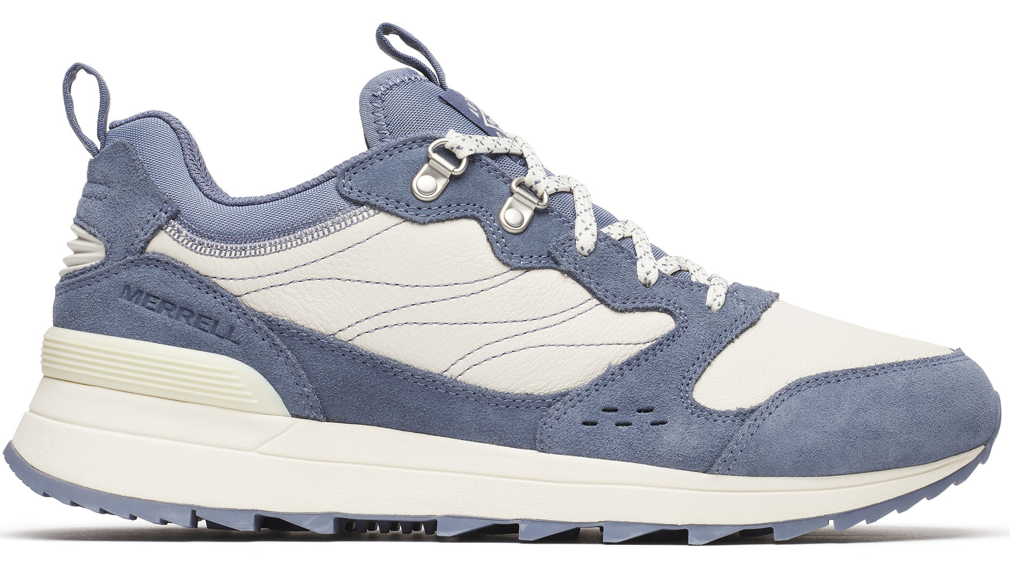 Light blue suede sneaker with white canvas panels and white speckled laces.