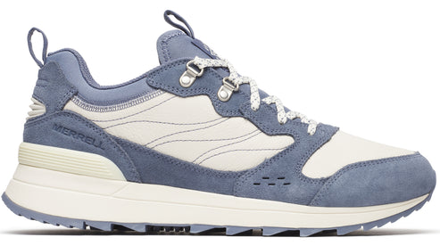 Light blue suede sneaker with white canvas panels and white speckled laces.