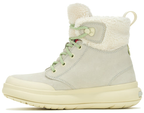 Light gray ankle boot with light green laces and plush white trim.