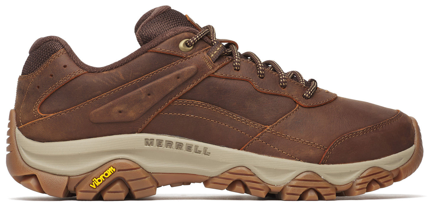 A brown leather shoe with a beige sole and a Vibram logo.