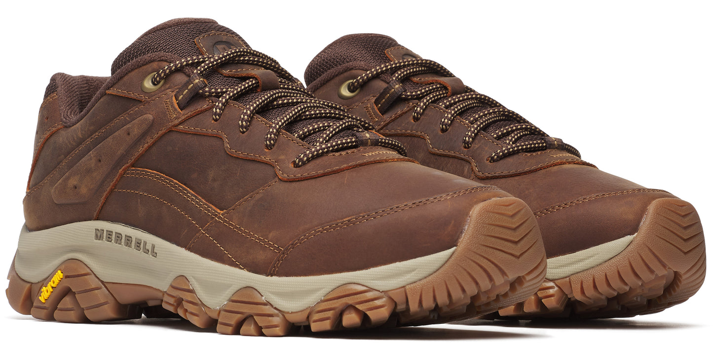 A pair of low-rise brown leather hiking shoes with patterned laces and tan soles.