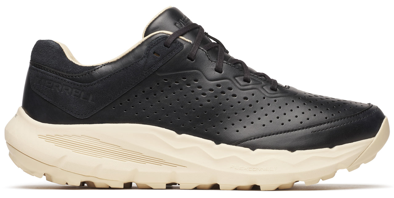 A black leather shoe with a white sole.