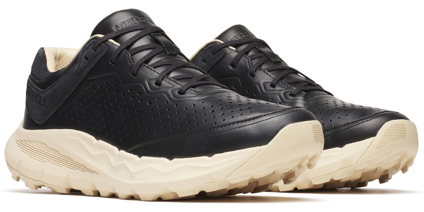 A pair of low-profile black leather shoes with a light beige jagged sole, lace-up closure, and perforated sides.