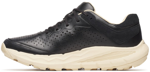 A black leather running shoe with perforated detailing and a cream-colored textured sole.