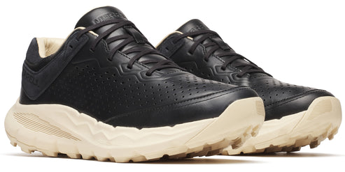 Pair of black leather sneakers with off-white soles and black laces.