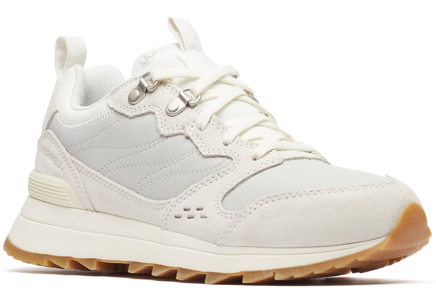 Off-white sneaker with lug sole, suede details, and metal eyelets.