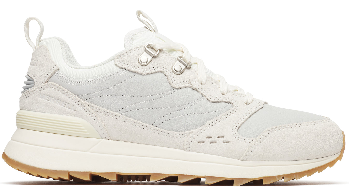 An off-white sneaker featuring a low-top design, lace-up closure, and a lug sole.