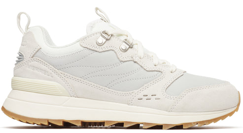 An off-white sneaker featuring a low-top design, lace-up closure, and a lug sole.