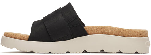 A slip-on sandal featuring a black upper and a thick, light-colored sole.