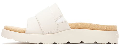 A white sandal with a thick sole and a tan footbed.
