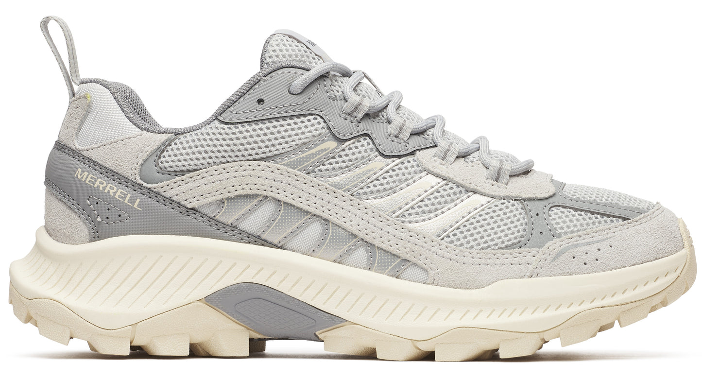 Light gray athletic shoe with thick white jagged sole, gray laces and the text "MERRELL" on the side.