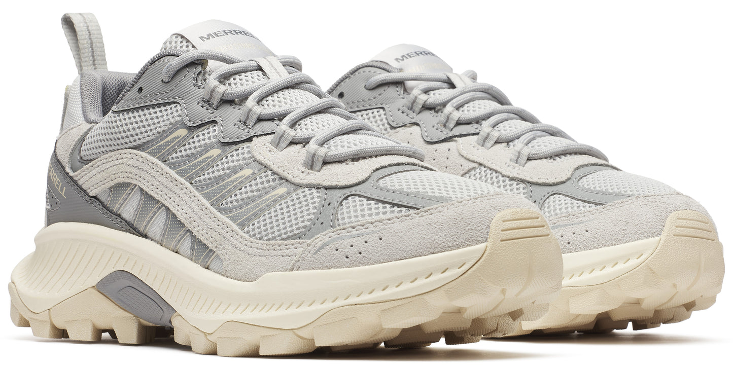 A pair of gray athletic shoes with light beige outsoles and thick laces.