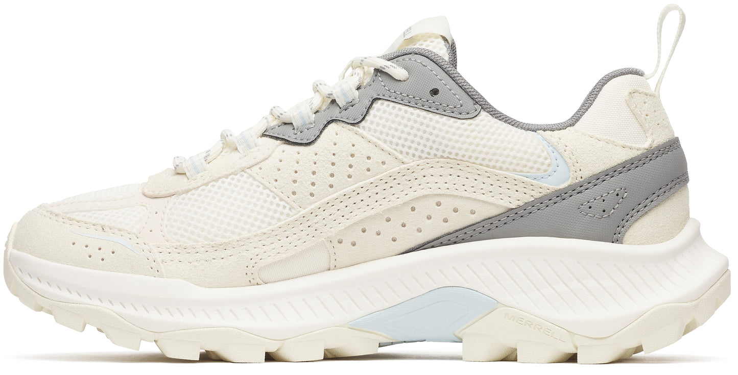 A trail running shoe with a neutral color scheme, featuring a layered upper, textured midsole, and lugged outsole.