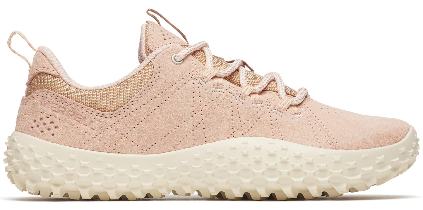 A pink sneaker with a bumpy white sole.