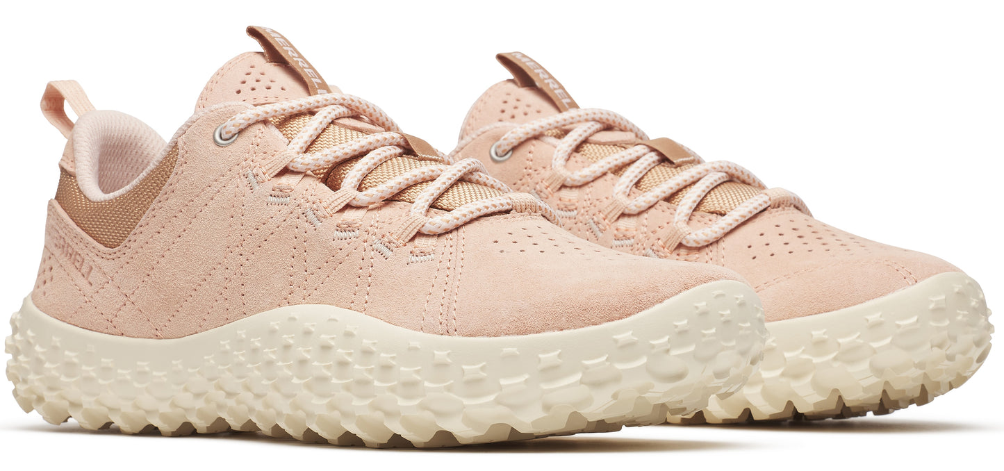 A pair of peach-colored tennis shoes with white soles and peach laces.