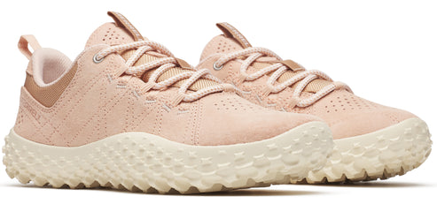 A pair of peach-colored tennis shoes with white soles and peach laces.