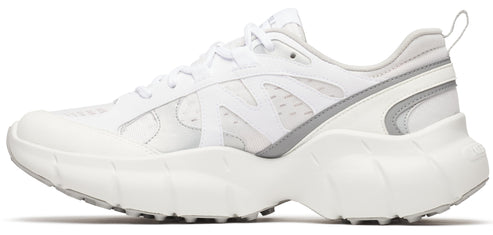 A white sneaker with white laces and gray accents.