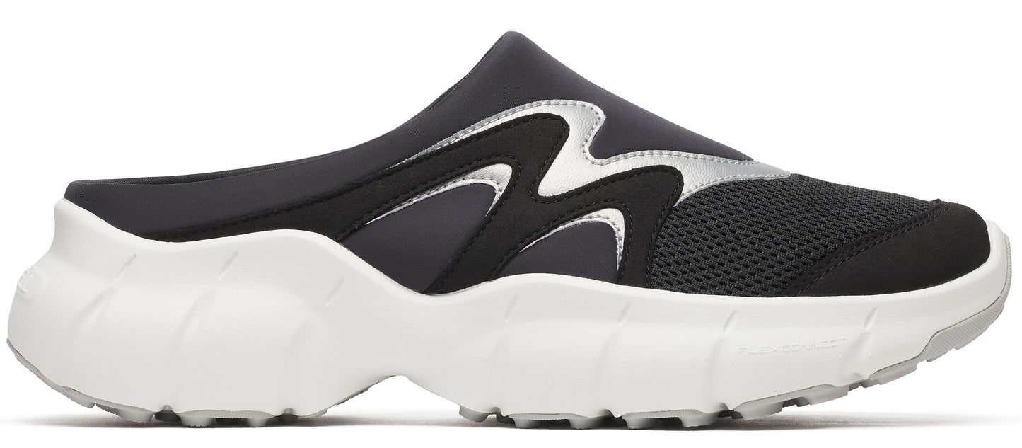 A black slip-on shoe with silver accents and a thick white sole.