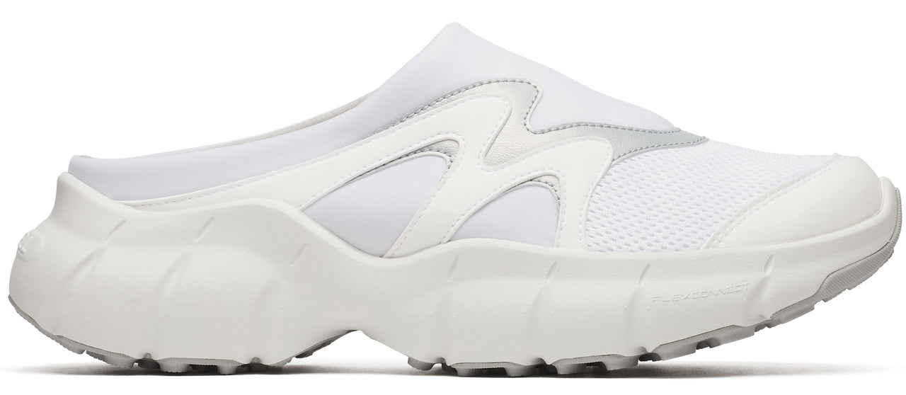 A white slip-on sneaker with a chunky sole.